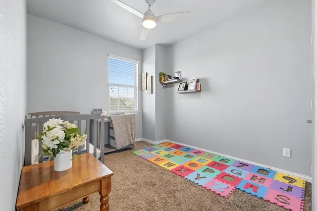a bedroom with furniture and a wooden floor
