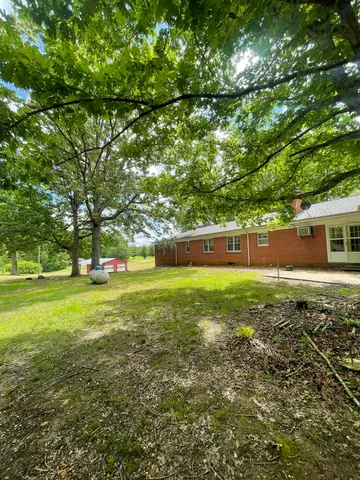 a view of backyard with green space