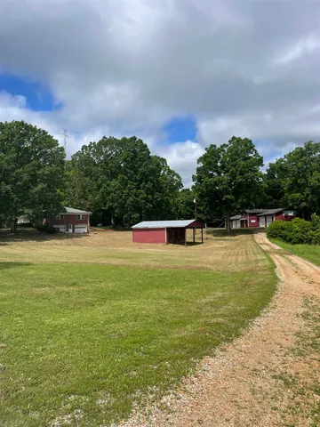 a swimming pool with an outdoor space and seating area