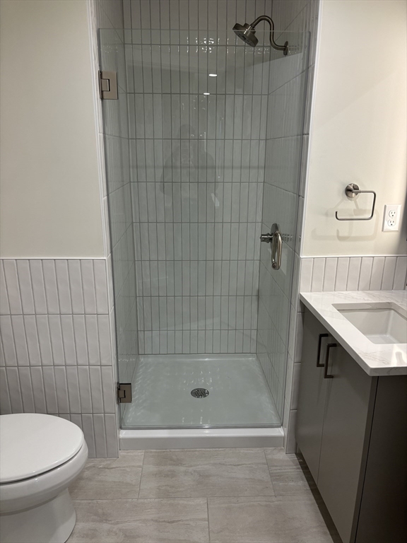 47 Winter Street, Unit 601 Boston, MA 02108 - Photo 3 of 12 a bathroom with a shower a toilet and a sink