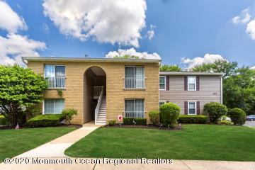 503 Harding Road, Unit 6 Freehold, NJ 07728 - Photo 1 of 23 a front view of a house with garden