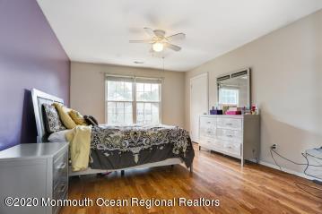 503 Harding Road, Unit 6 Freehold, NJ 07728 - Photo 18 of 23 a living room with a bed furniture and a window