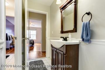 503 Harding Road, Unit 6 Freehold, NJ 07728 - Photo 23 of 23 a bathroom with a sink and a mirror