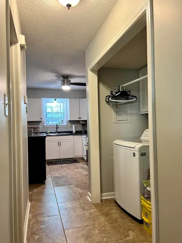 a kitchen with a refrigerator and a stove