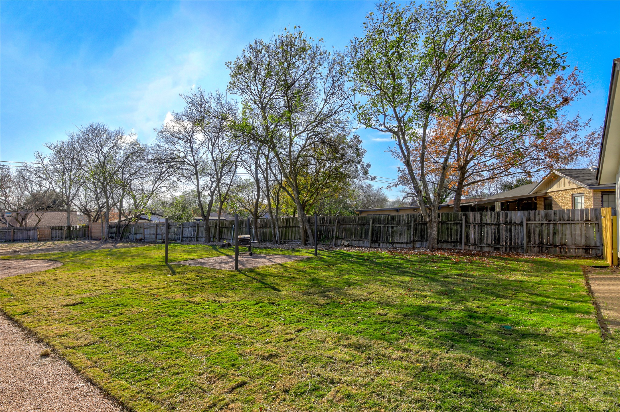 10509 Macmora Road, Unit B Austin, TX 78758 - Photo 18 of 19 a swimming pool with outdoor seating and yard