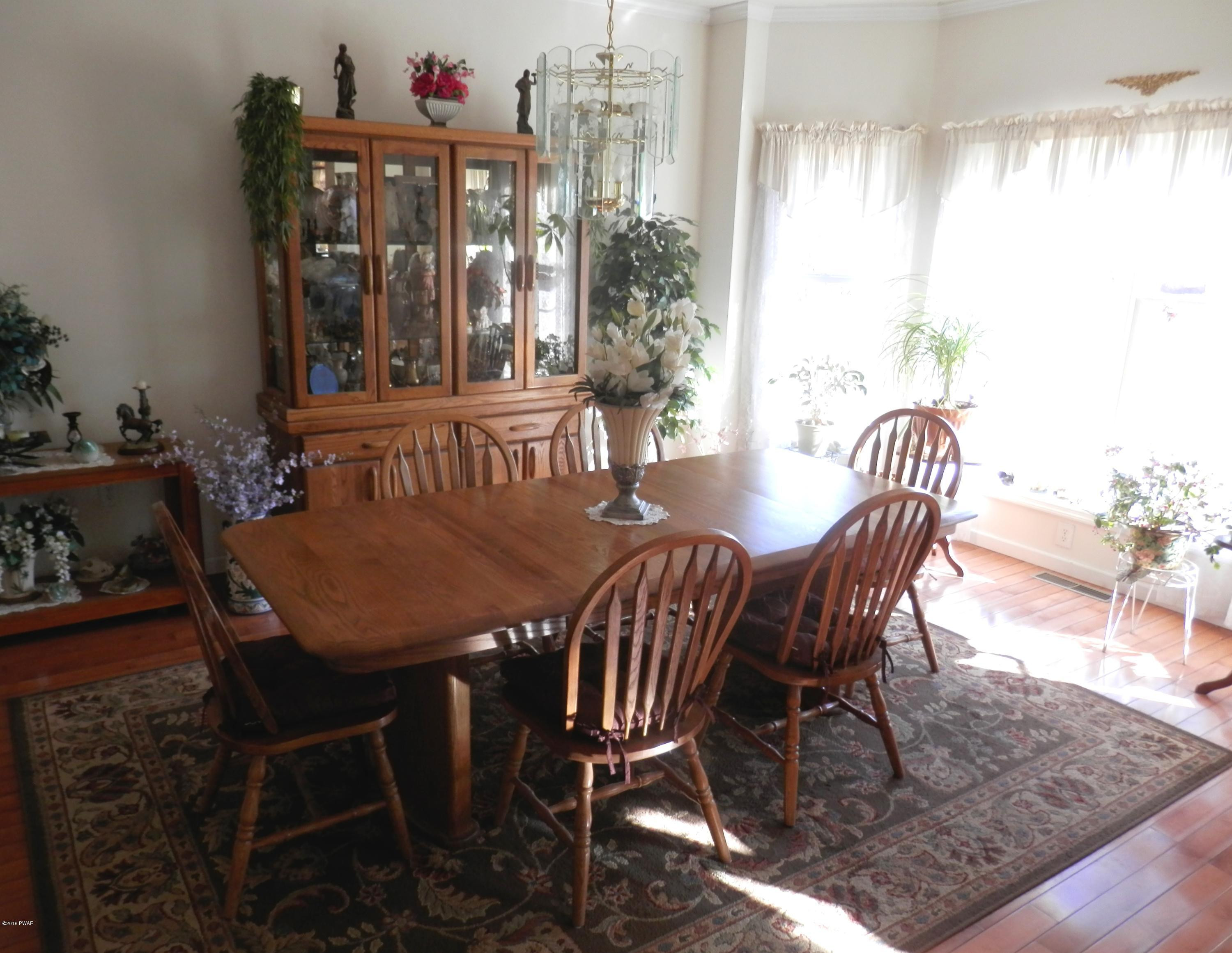 176 Highland Road Pleasant Mount, PA 18453 - Photo 14 of 52 a view of a dining room with furniture and window