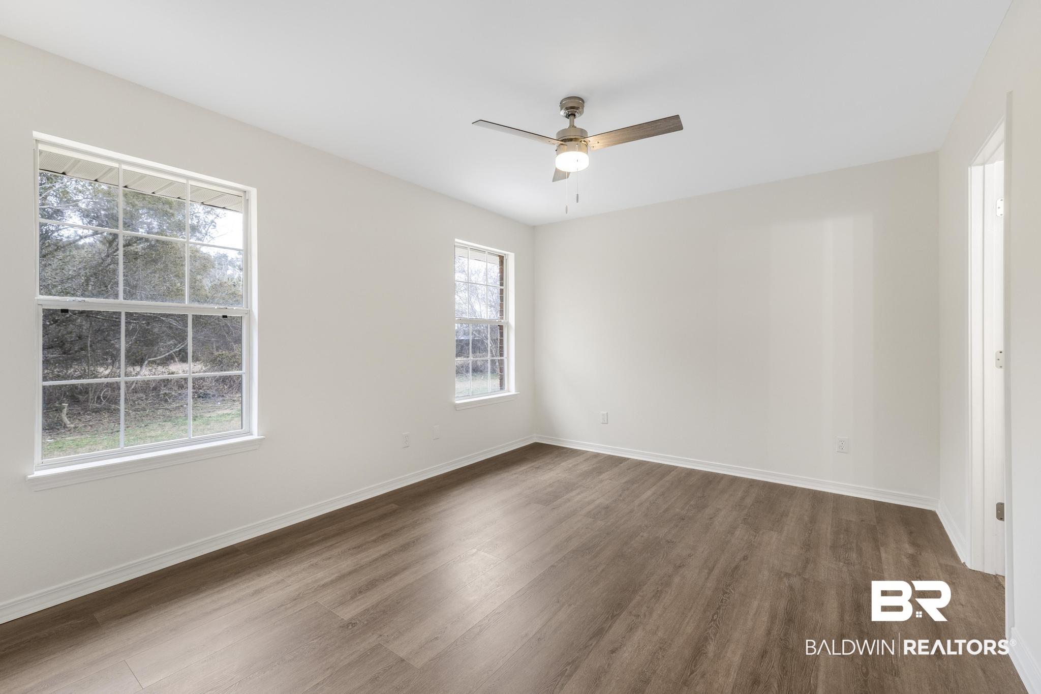 16330 Absalom Street Foley, AL 36535 - Photo 34 of 42 Spare room featuring dark hardwood / wood-style flooring and ceiling fan
