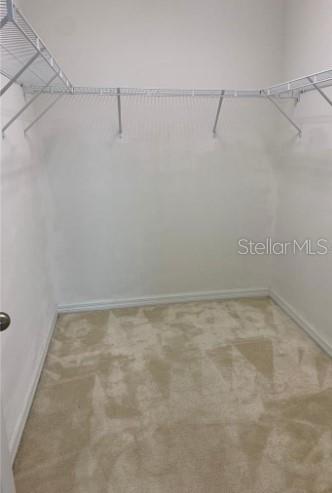 5706 Cypress Hill Road Winter Garden, FL 34787 - Photo 12 of 21 a view of a room with racks on the wall