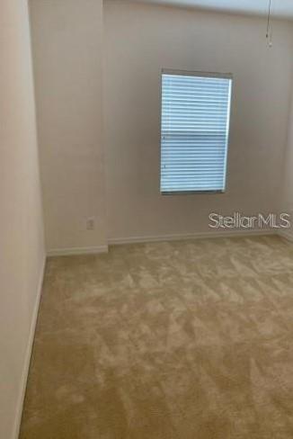 5706 Cypress Hill Road Winter Garden, FL 34787 - Photo 17 of 21 an empty room with a window