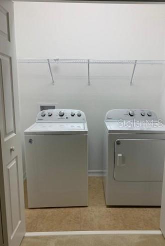 5706 Cypress Hill Road Winter Garden, FL 34787 - Photo 19 of 21 a utility room with dryer and washer