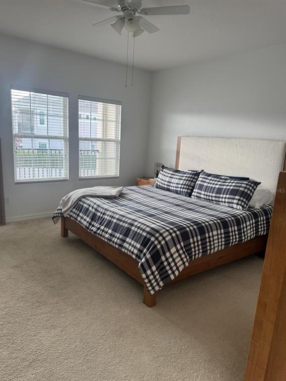 5706 Cypress Hill Road Winter Garden, FL 34787 - Photo 9 of 21 a bedroom with a bed and window