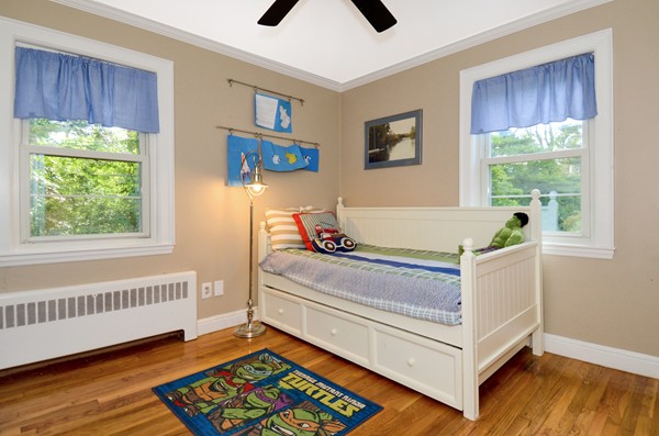 50 Topsfield Road Ipswich, MA 01938 - Photo 21 of 29 a living room with a bed and a window