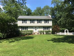 35 White Birch Road South Pound Ridge, NY 10576 - Photo 1 of 1 a front view of a house with a garden