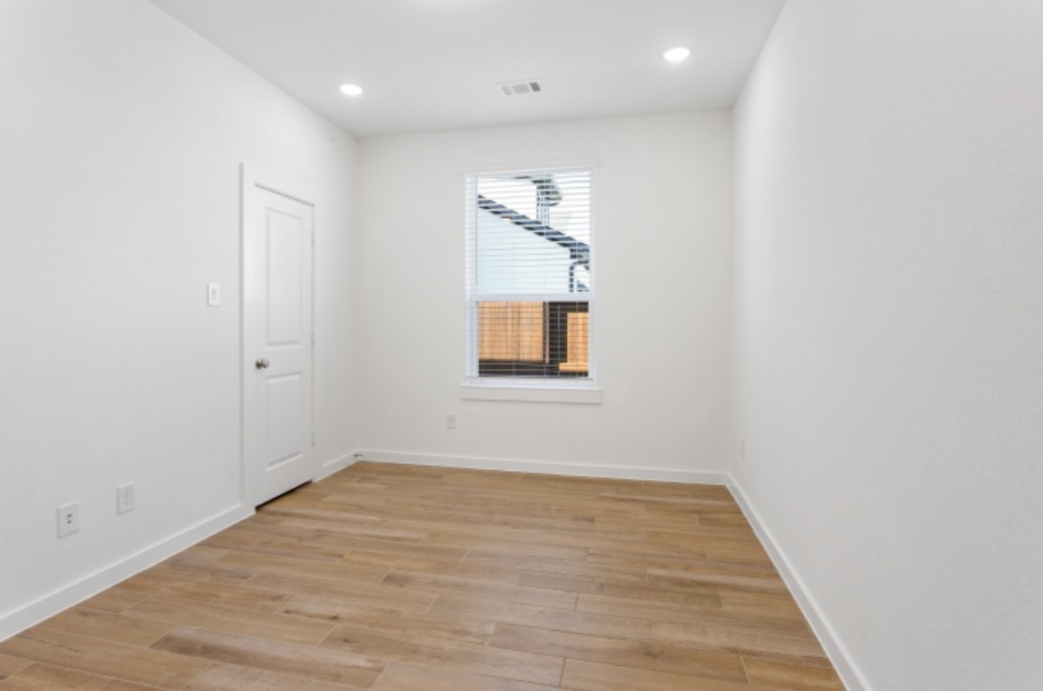10227 Van Gogh Court Iowa Colony, TX 77578 - Photo 14 of 25 Private study/bedroom with Insulated wall sound barrier as an upgrade feature along with dimmable LED lights.