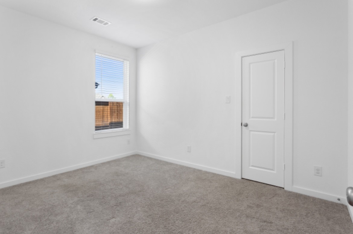 10227 Van Gogh Court Iowa Colony, TX 77578 - Photo 15 of 25 Bright and comfortable bedroom 2 with easy access to bathroom.