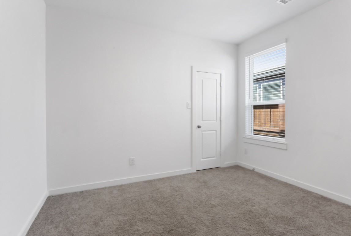 10227 Van Gogh Court Iowa Colony, TX 77578 - Photo 16 of 25 Bright and comfortable bedroom 3 with easy access to bathroom.