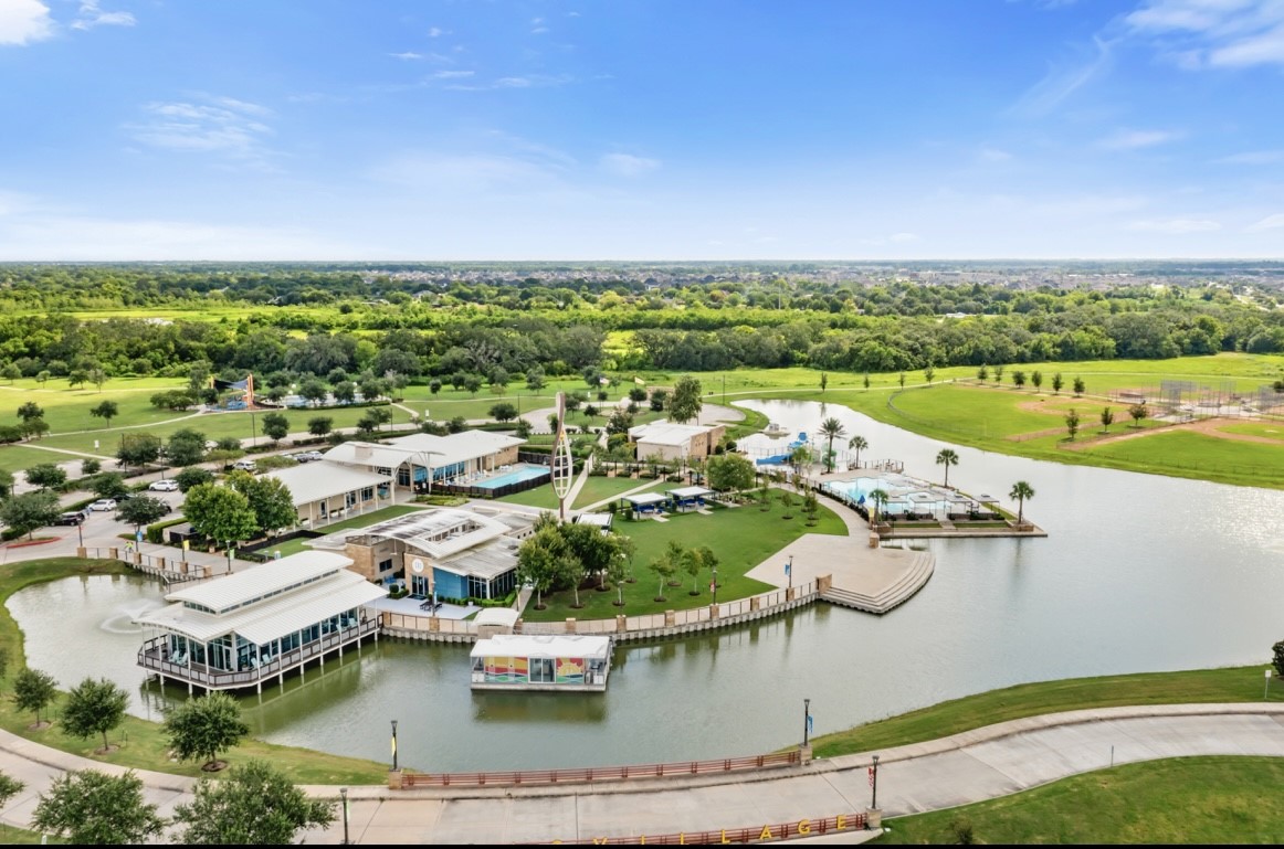 10227 Van Gogh Court Iowa Colony, TX 77578 - Photo 23 of 25 Community welcome center also includes amenities such as an splash pad, it's own onsite restaurant, and much more for residents to enjoy.