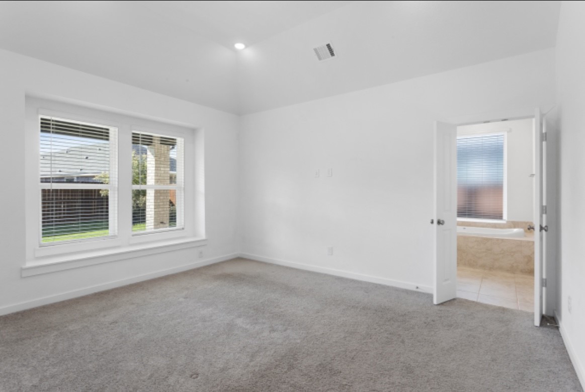 10227 Van Gogh Court Iowa Colony, TX 77578 - Photo 9 of 25 Spacious master bedroom with plenty of natural light and peaceful retreat feel with blinds included.