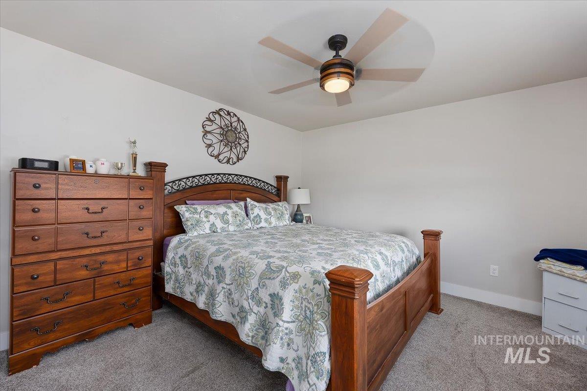 40 Bell Rapids Road Hagerman, ID 83332 - Photo 28 of 50 Bedroom featuring light colored carpet and ceiling fan