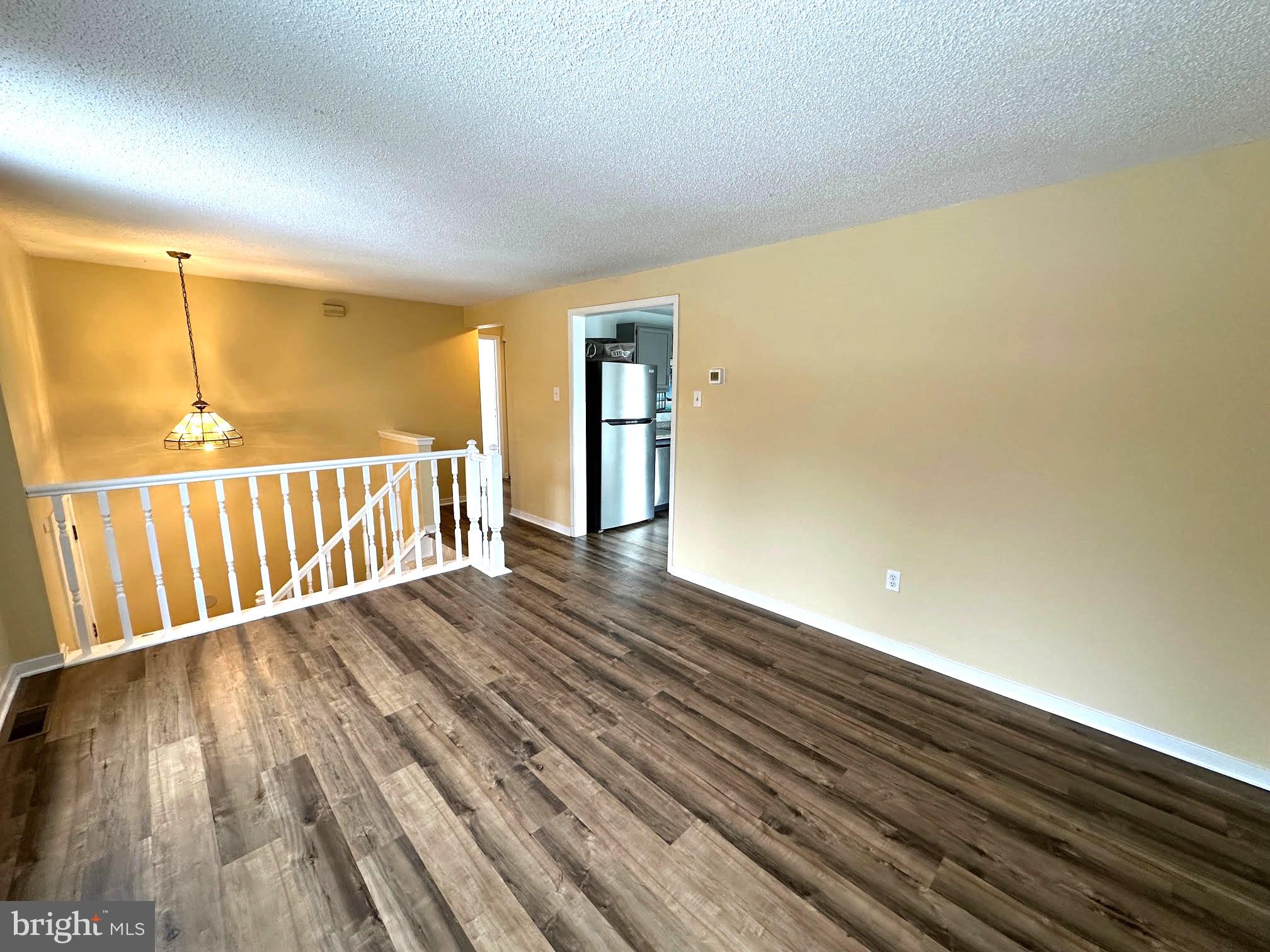 119 Cove Point Road Lusby, MD 20657 - Photo 11 of 22 a view of a room with wooden floor