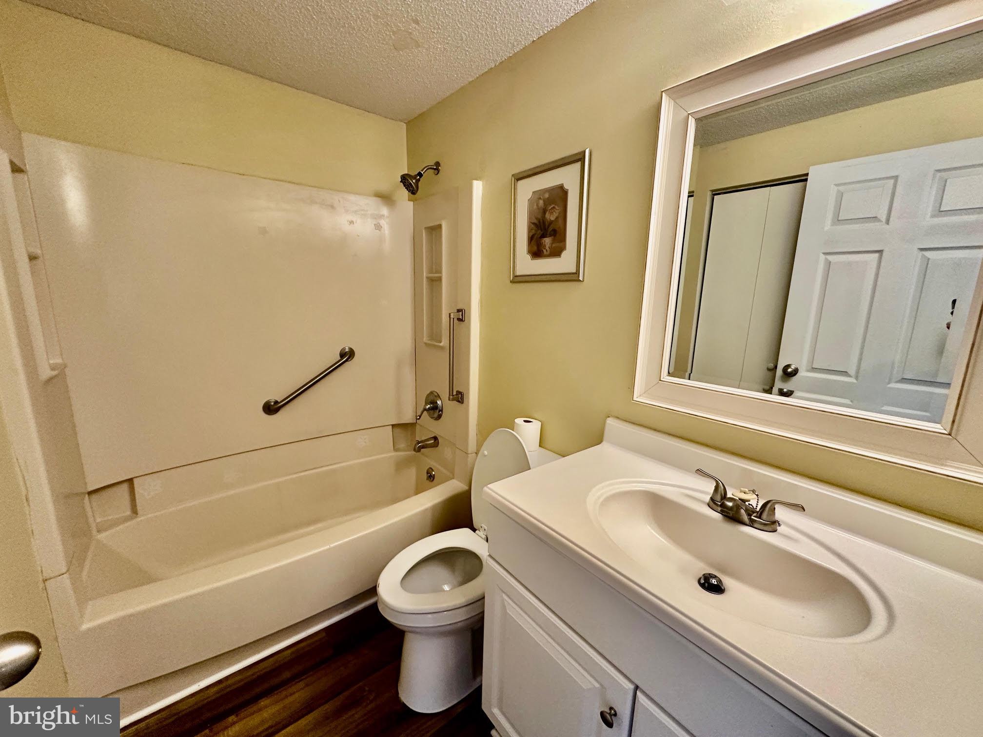 119 Cove Point Road Lusby, MD 20657 - Photo 13 of 22 a bathroom with a sink toilet and shower