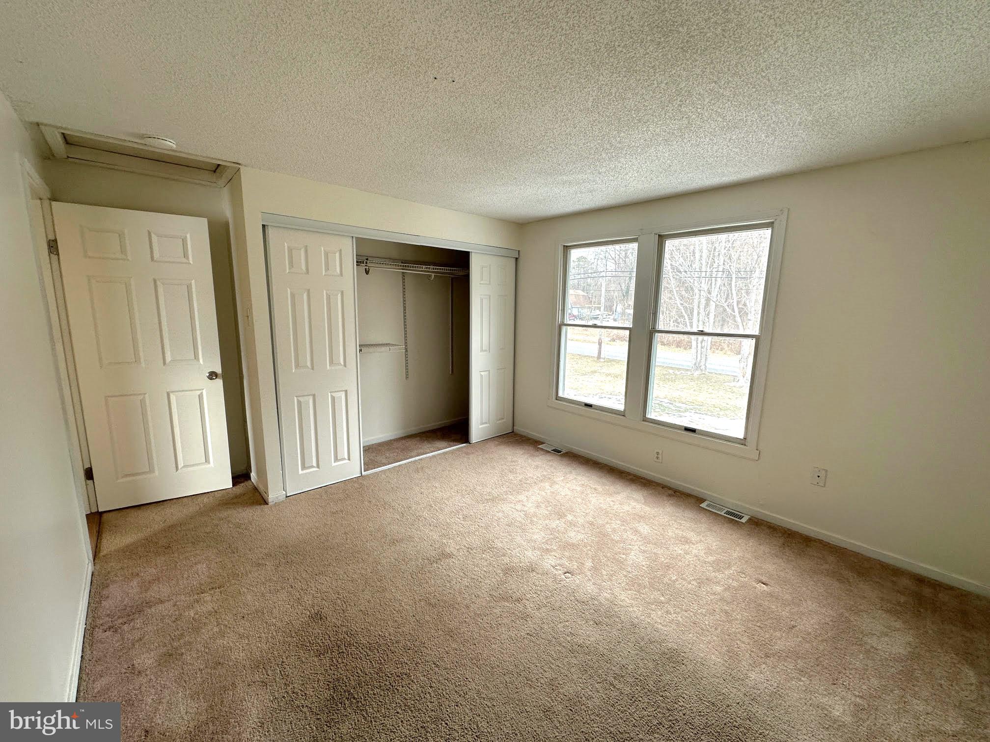 119 Cove Point Road Lusby, MD 20657 - Photo 14 of 22 an empty room with windows