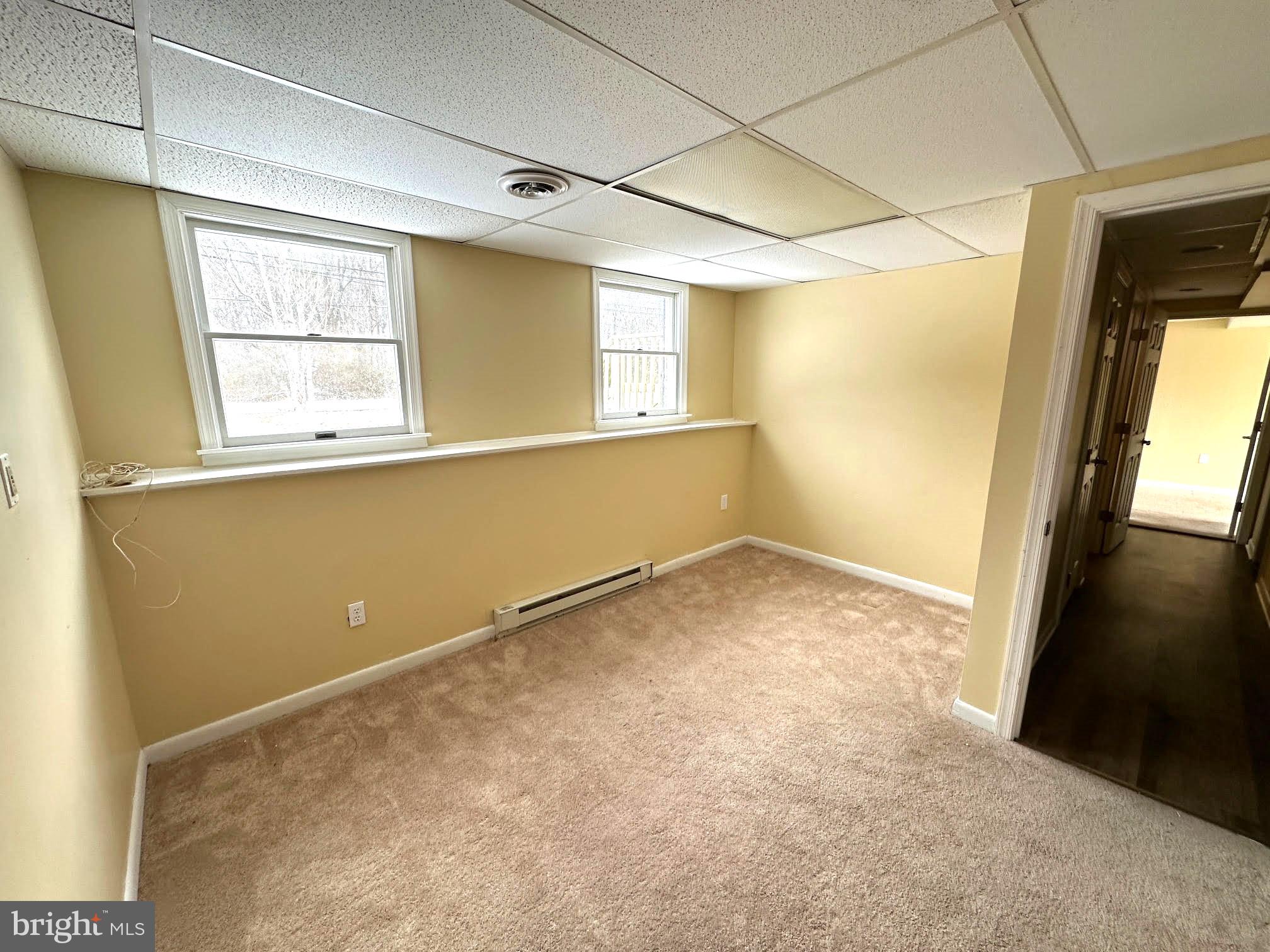 119 Cove Point Road Lusby, MD 20657 - Photo 19 of 22 a view of an empty room with a window