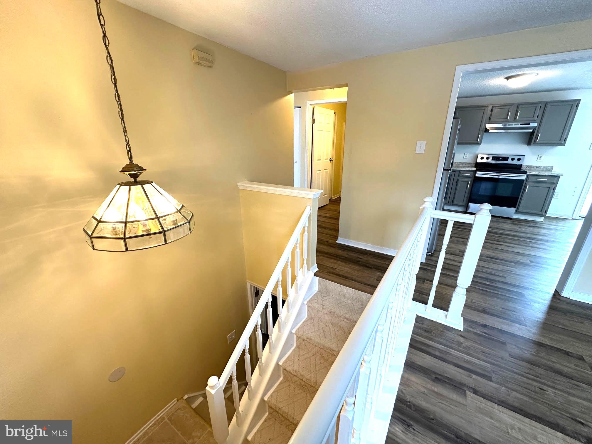 119 Cove Point Road Lusby, MD 20657 - Photo 5 of 22 Staircase with brand new carpet runner