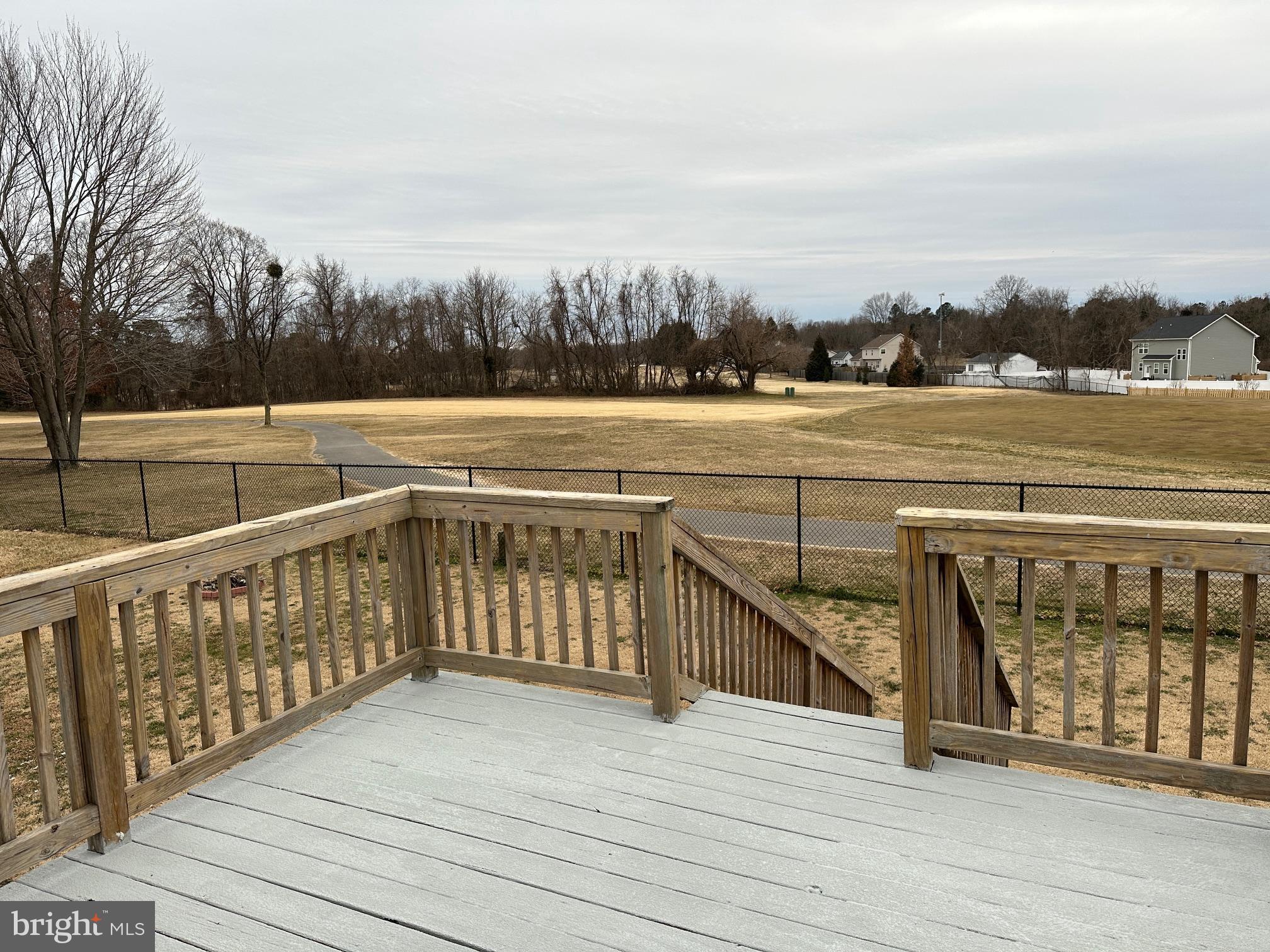 119 Cove Point Road Lusby, MD 20657 - Photo 6 of 22 a view of balcony with wooden floor and fence
