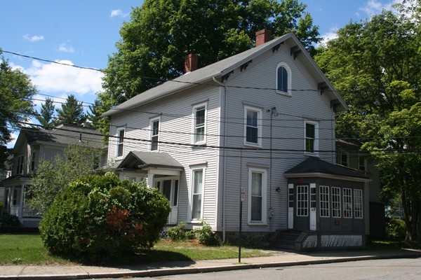 355 Walnut Street Newton, MA 02460 - Photo 1 of 5 a front view of a house with a yard