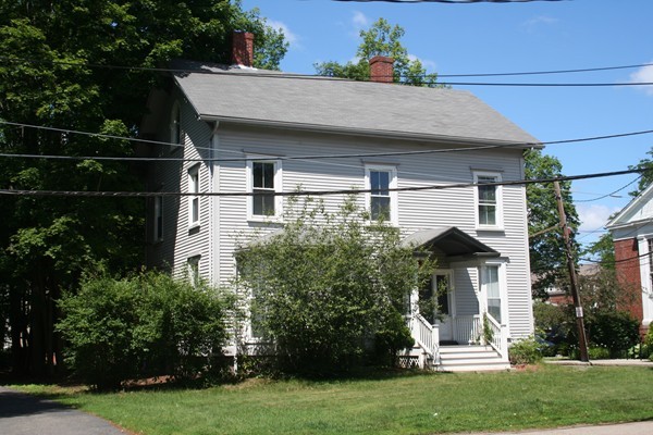 355 Walnut Street Newton, MA 02460 - Photo 2 of 5 a front view of a house with a garden