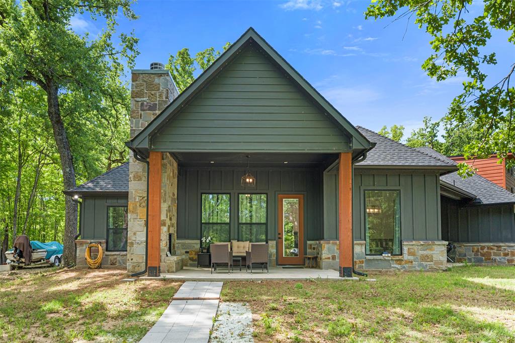 265 Shadow Oaks Streetman, TX 75859 - Photo 31 of 40 a view of a house with backyard porch and sitting area