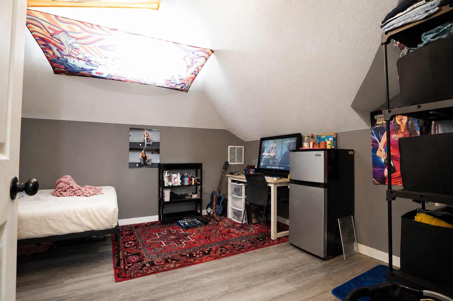 158 Buena Fortuna Road Elgin, TX 78621 - Photo 22 of 40 Sloped ceilings and a dormer window define this cozy bedroom space with durable flooring.