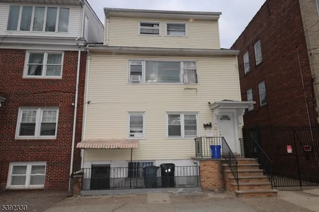 a view of a house with large windows