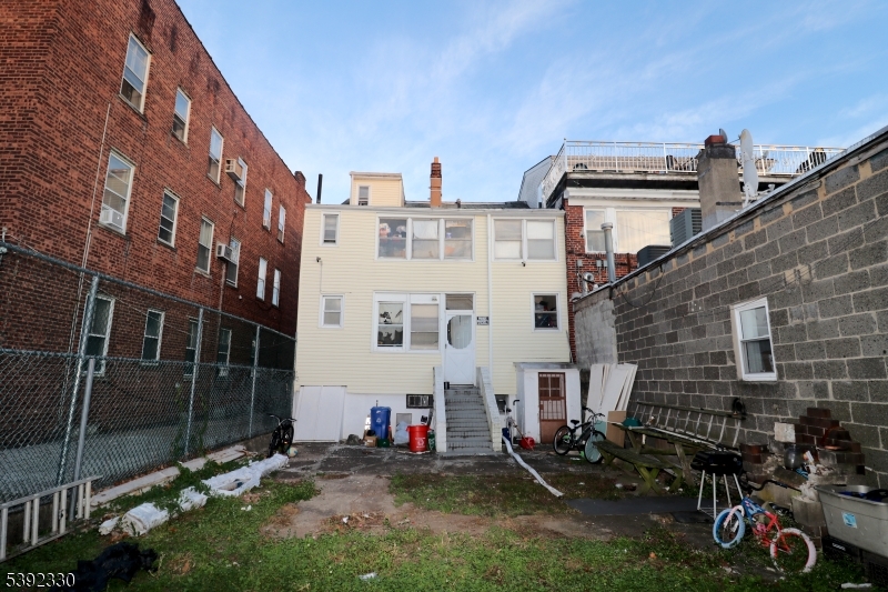233 Adams Street Newark, NJ 07105 - Photo 5 of 14 a view of a building with many windows