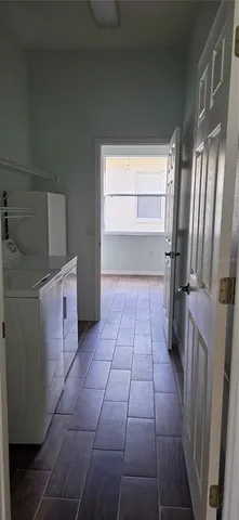 a kitchen with a sink a counter space and a window