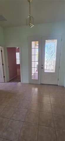 a view of an empty room with windows