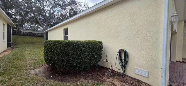a backyard of a house with lots of green space