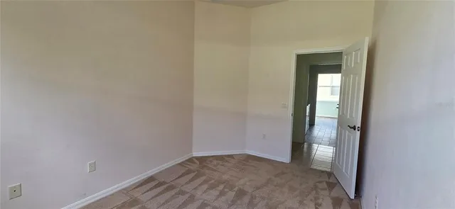 a view of a small space with wooden floor