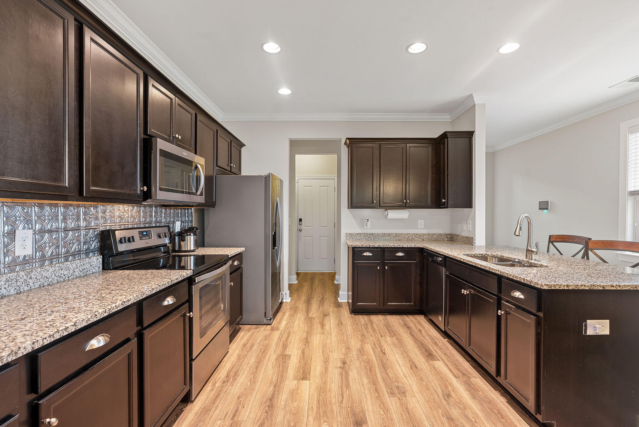 4072 Exploration Road Ladson, SC 29456 - Photo 5 of 34 Kitchen with dark wood cabinets