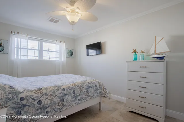 a bedroom with a bed and a dresser