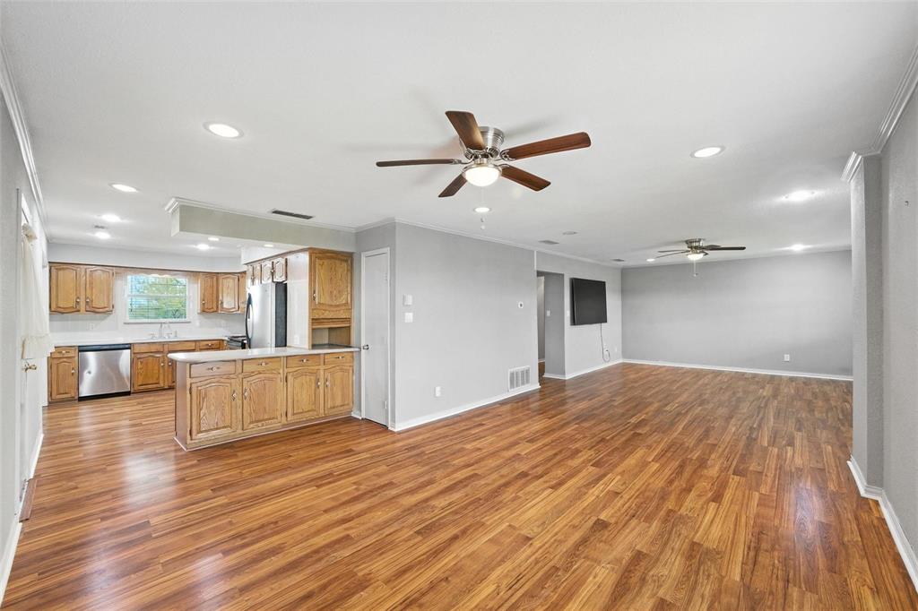 358 Wright Road Waxahachie, TX 75167 - Photo 19 of 38 a view of a living room a wooden floor and a ceiling fan