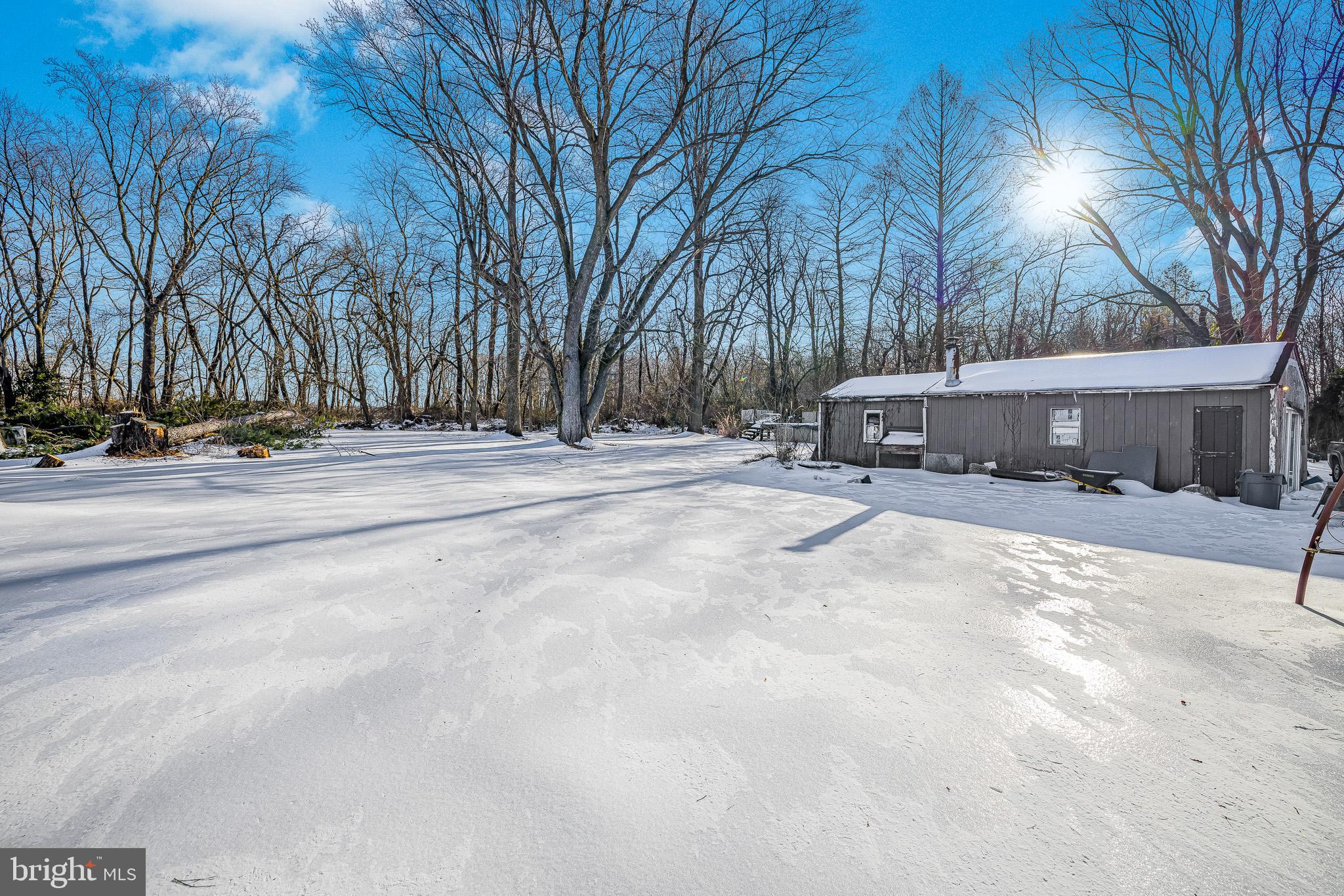 1408 Blackiston Road Clayton, DE 19938 - Photo 18 of 20 a view of a house with snow on the road