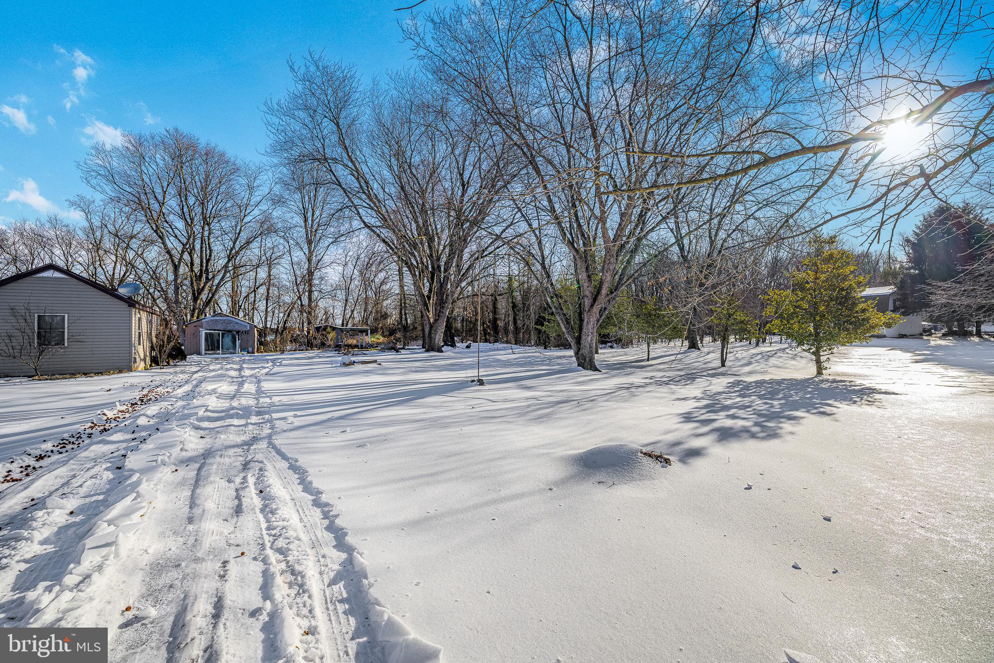 1408 Blackiston Road Clayton, DE 19938 - Photo 20 of 20 a view of road with covered with snow