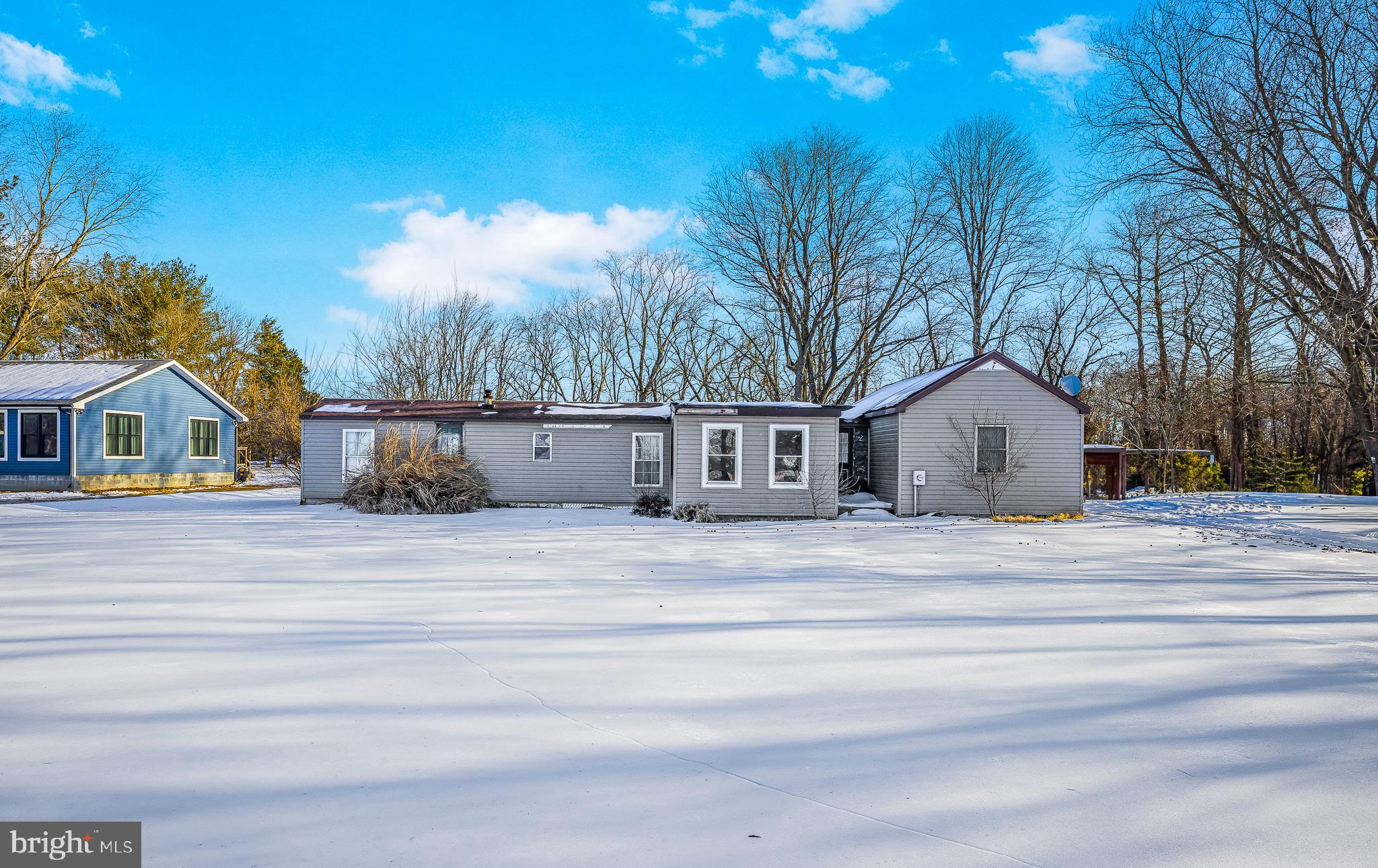 1408 Blackiston Road Clayton, DE 19938 - Photo 2 of 20 a view of house with yard and tree in the background