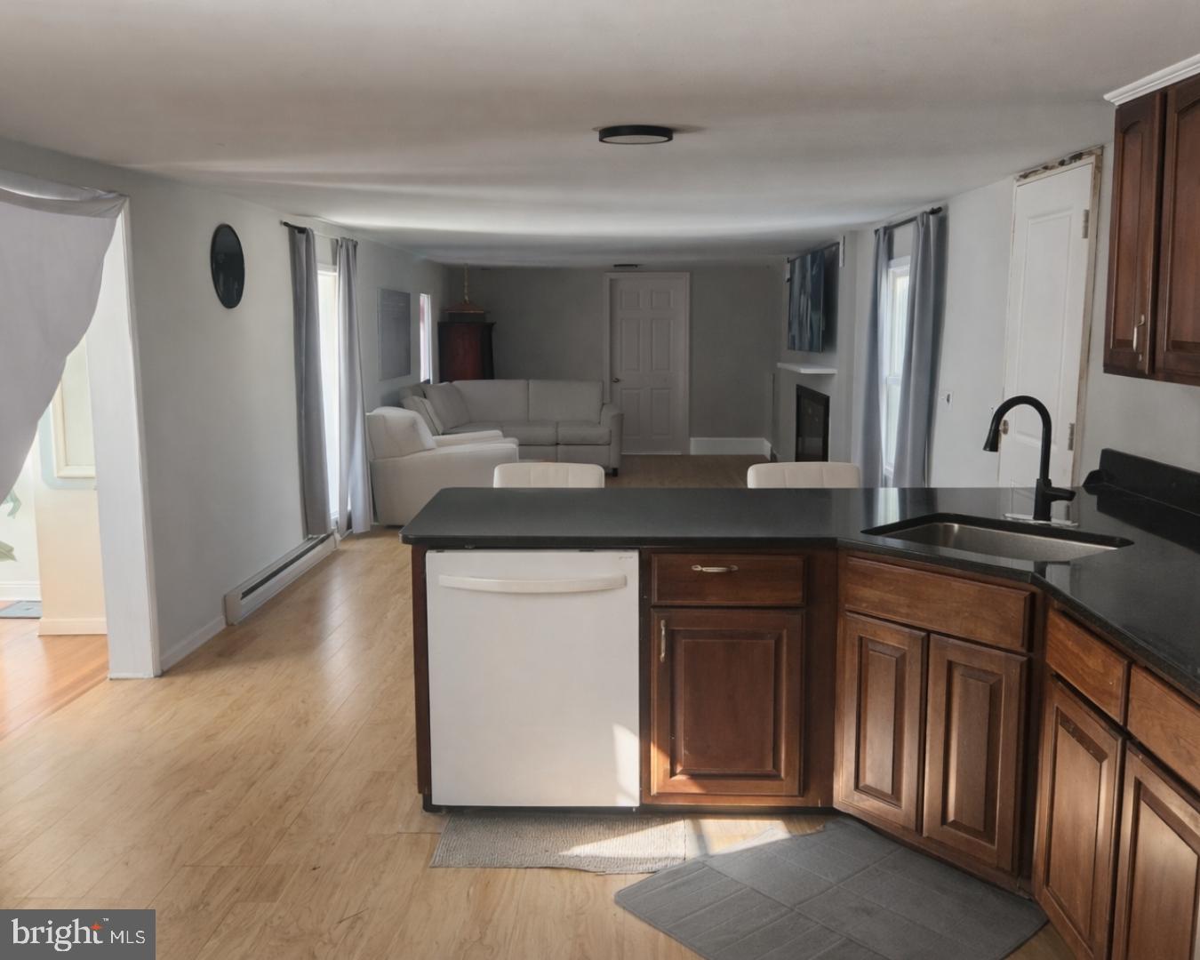 1408 Blackiston Road Clayton, DE 19938 - Photo 5 of 20 a kitchen with granite countertop a sink and a stove top oven