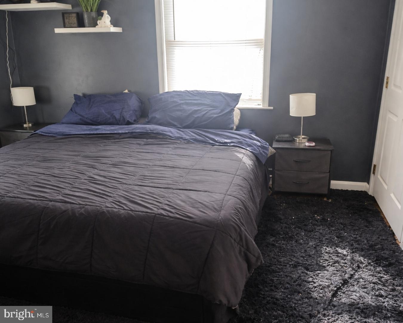 1408 Blackiston Road Clayton, DE 19938 - Photo 6 of 20 a bedroom with a bed and a window