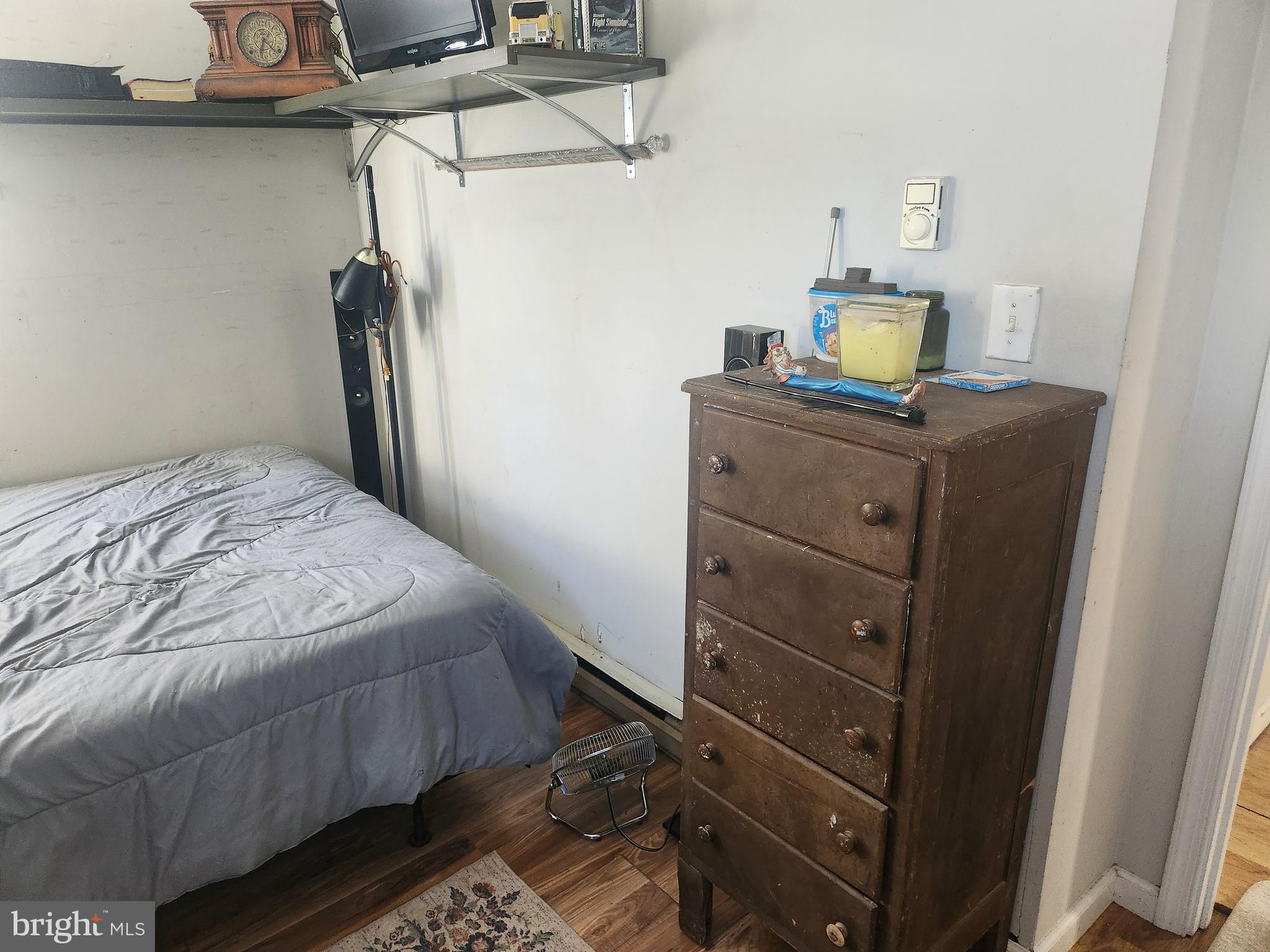 1408 Blackiston Road Clayton, DE 19938 - Photo 7 of 20 a bedroom with a bed and a desk
