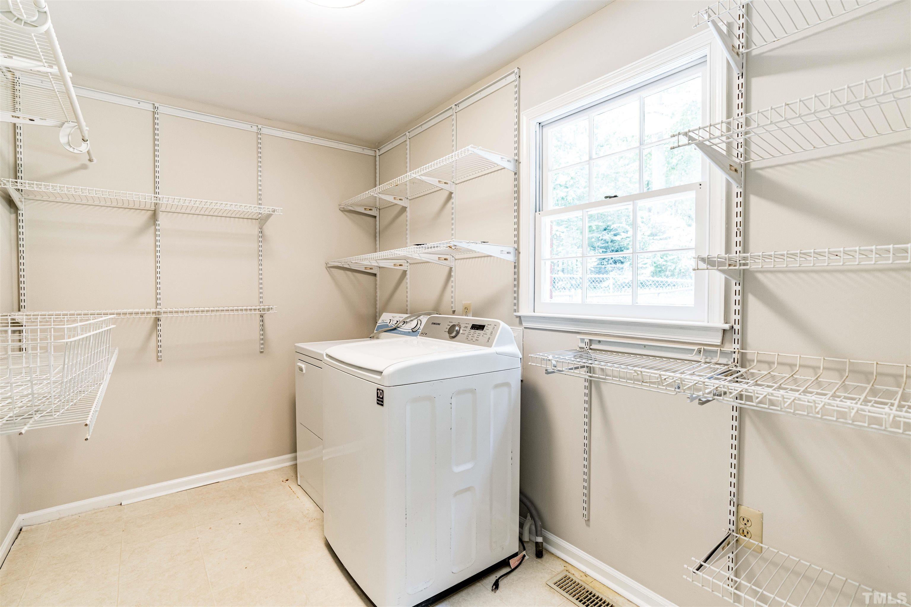 8645 Valley Brook Drive Raleigh, NC 27613 - Photo 15 of 32 a utility room with dryer and washer