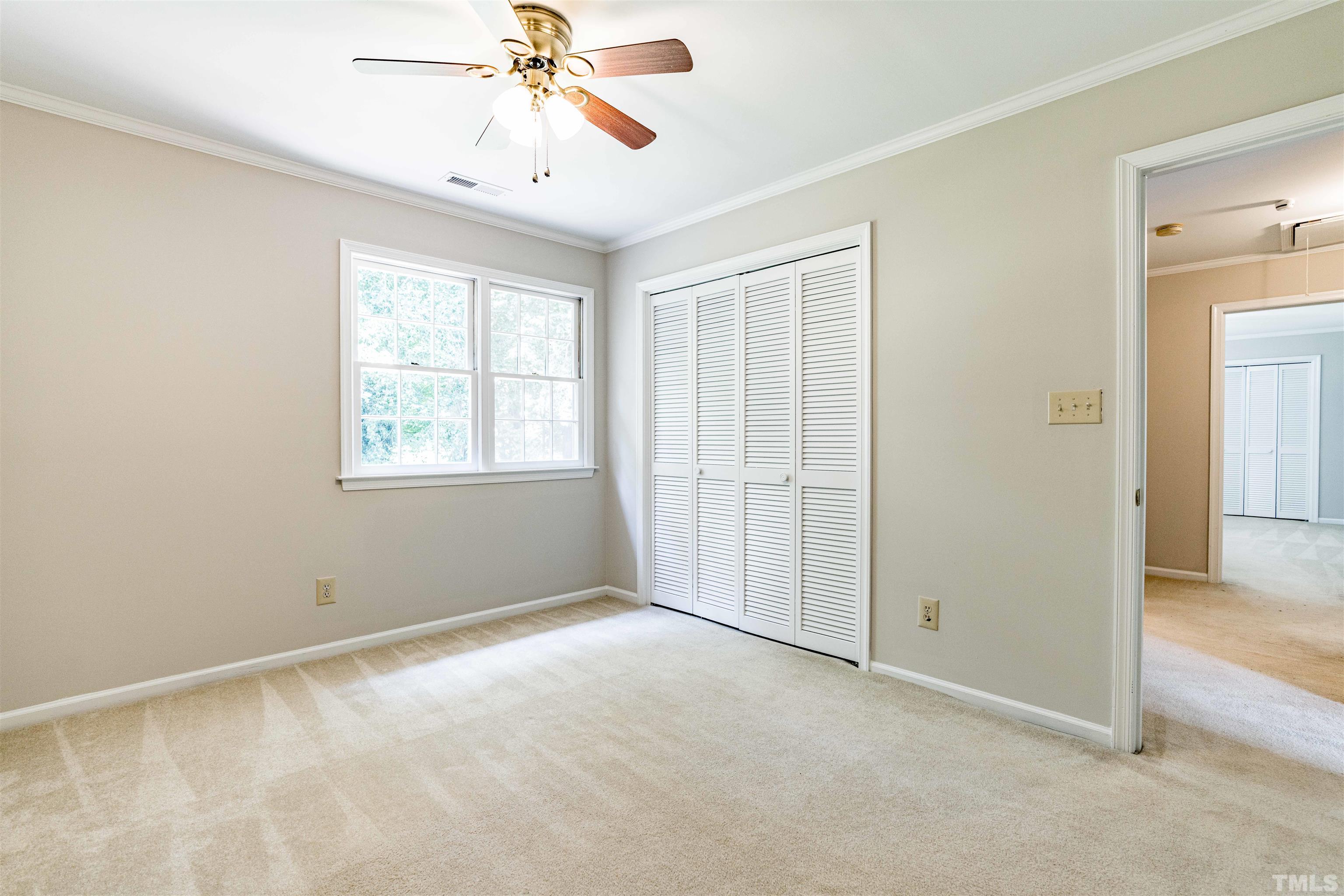 8645 Valley Brook Drive Raleigh, NC 27613 - Photo 25 of 32 a view of an empty room with a window